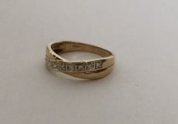A 9 carat diamond crossover ring. Approx. 2.1 gram
