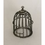 A novelty silver model of a birdcage with twisted