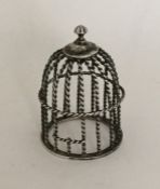 A novelty silver model of a birdcage with twisted