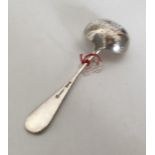 A Russian silver and silver gilt sifter spoon with