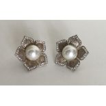 BRIDAL JEWELLERY: A pair of silver and faux pearl ear c