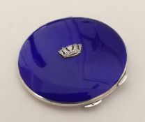 A silver and enamelled compact with fitted interio