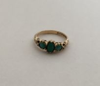 A 9 carat three stone turquoise ring. Approx. 2.2