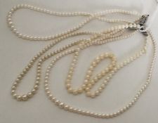 A double string of pearl beads together with two o