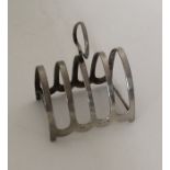 An Edwardian silver toast rack / smartphone dockin