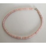 A silver mounted pearl necklace. Approx. 31 grams.