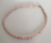 A silver mounted pearl necklace. Approx. 31 grams.