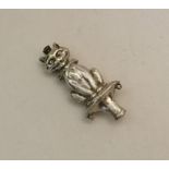 A novelty silver rattle mount in the form of a cat