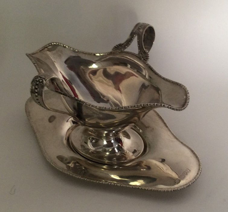 A good quality double lipped silver sauce boat on