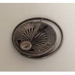 An unusual silver travelling compass / sun dial. A
