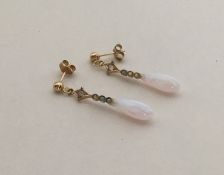 A pair of opal and gold tapering earrings with loo