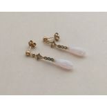 A pair of opal and gold tapering earrings with loo