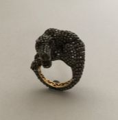 A large unusual gold ring in the form of an alliga