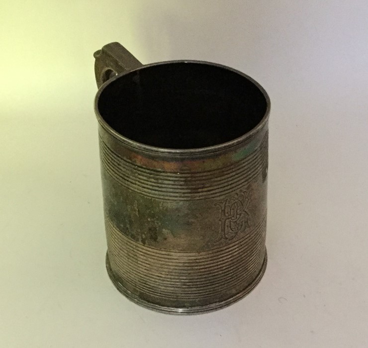 A Georgian silver tapering mug with reeded decorat - Image 2 of 2