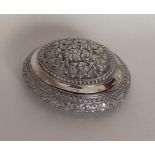 A Dutch silver 19th Century oval box with chased f