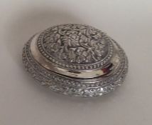 A Dutch silver 19th Century oval box with chased f