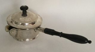 An Antique Russian silver brandy pan on turned han