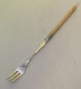 A good silver pickle fork with turned ivory handle