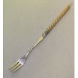 A good silver pickle fork with turned ivory handle
