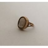 An Antique hard stone oval cameo ring depicting a