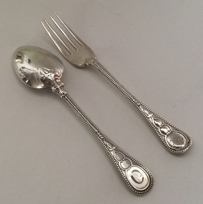 A child's two piece silver christening set with be