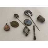 A silver thimble together with a Scottish brooch e