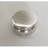 A circular silver dressing table box. Birmingham 1