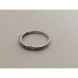 A 9 carat diamond mounted band ring. Approx. 1.8 g
