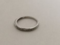 A 9 carat diamond mounted band ring. Approx. 1.8 g