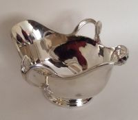 A heavy silver plated double lipped sauce boat. By