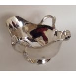 A heavy silver plated double lipped sauce boat. By