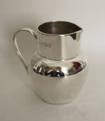 An attractive silver cream jug in the form of a je