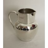 An attractive silver cream jug in the form of a je