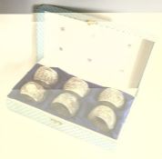A boxed set of six Indian silver napkin rings. App