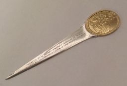 A silver and silver gilt paper knife. London. By G