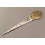 A silver and silver gilt paper knife. London. By G