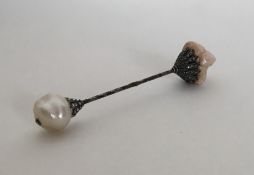 A rose diamond and pearl double clip pin set in si