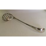 A large Dutch silver sifter spoon with pierced bow