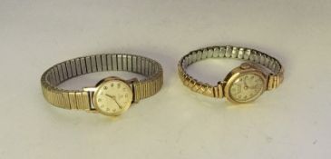 A lady's gold wristwatch together with one other.