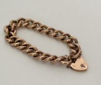 A good quality 9 carat curb link bracelet with cha