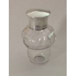 An Antique glass mounted scent bottle with screw-o