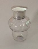 An Antique glass mounted scent bottle with screw-o