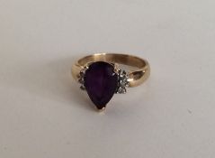 A 10 carat amethyst and diamond seven stone ring i