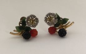 A pair of unusual diamond mounted earrings decorat