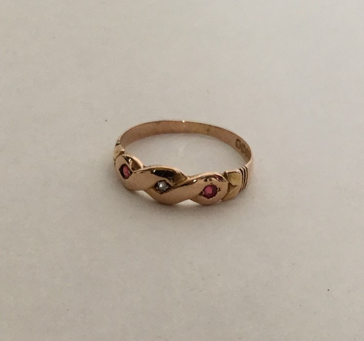 An Antique ruby and diamond gypsy set ring. Approx