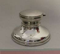 A large Edwardian silver capstan shaped inkwell. B