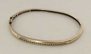 A 9 carat yellow gold and diamond bracelet. Approx