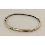 A 9 carat yellow gold and diamond bracelet. Approx