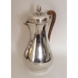 A good Georgian silver baluster shaped jug with ca