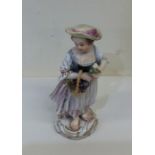 A decorative Meissen figure of a girl with basket.